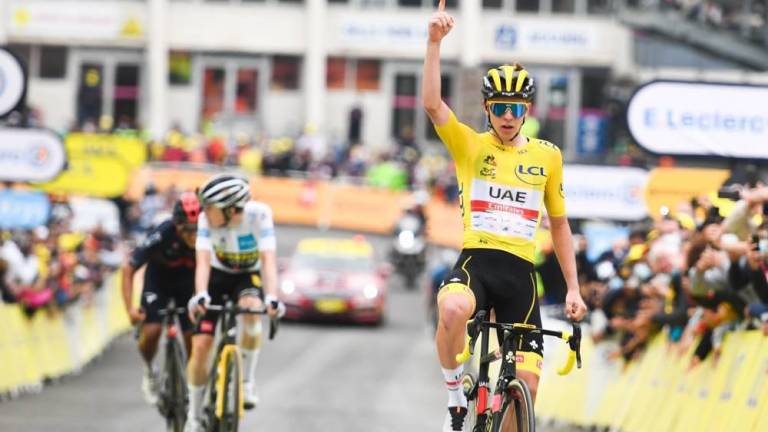 Tadej Pogacar celebra su tercer triunfo en la edición 2021 del Tour de Francia.