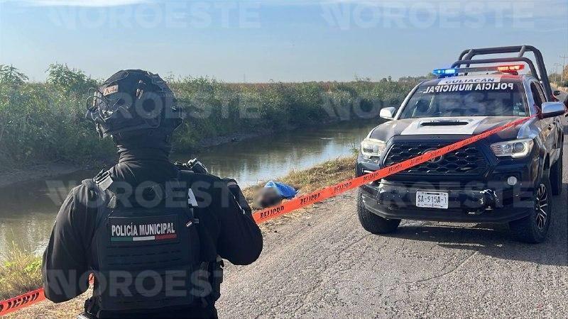 $!Localizan a hombre sin vida y esposado en canal de riego en Culiacán