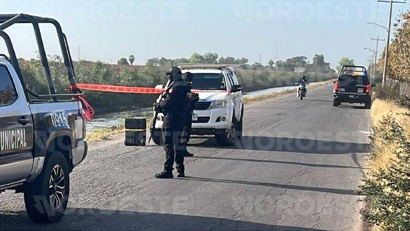 $!Localizan a hombre sin vida y esposado en canal de riego en Culiacán