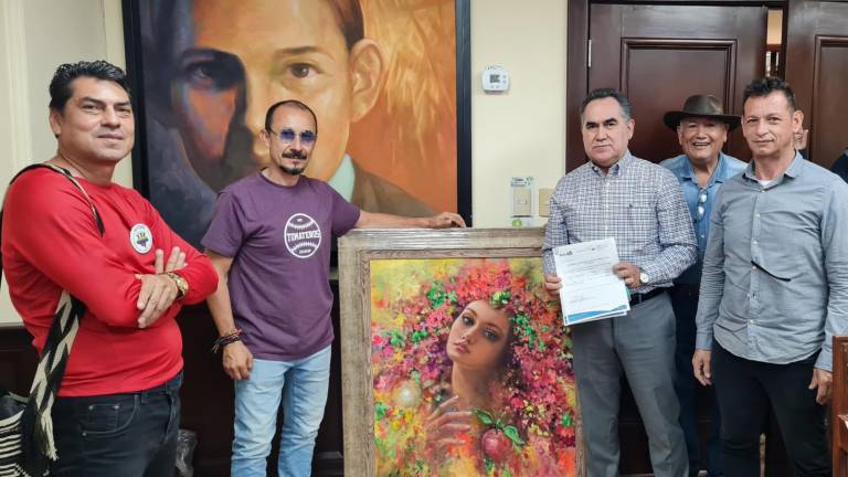 El artista plástico José Alonso Loaiza, de origen colombiano hizo entrega al rector de la UAS, Jesús Madueña Molina, una obra pictórica de factura propia.